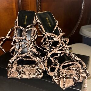 Brown,black and white heels only wore one time. Basically new.